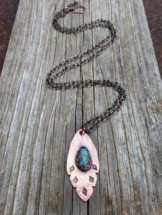 This copper feather pendant features a stunning old stock (1970's) natural Kingman turquoise (or any stone of your choice) highlighted with an organic, tribal stamped design.  The copper has been oxidized for a rustic, aged look.  This necklace features an extra long, solid copper chain and looks great worn alone or layered with other necklaces.  The necklace in the photos has sold but I can recreate this for you using any stone.  I have lots of turquoise in stock also; including some of the 197 Bohemian Engraved Turquoise Necklaces, Bohemian Engraved Copper Necklaces, Bohemian Hand Forged Turquoise Necklace, Bohemian Turquoise Pendant Necklace With Patina, Bohemian Turquoise Oval Pendant For Jewelry Making, Bohemian Turquoise Oval Pendant Necklace, Bohemian Teardrop Pendant Copper Necklace, Bohemian Copper Teardrop Pendant Necklace, Bohemian Stamped Jewelry For Jewelry Making