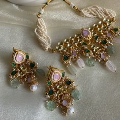 stunning kundan pendant set with pearl details and pink, green and emerald hints. matching earrings. please note transparent beads vary slightly in appearance. set includes: necklace, earrings. Turquoise Jewelry Indian, Kundan Pendant Set, Diwali Jewellery, Baby Pink Clothes, Choker Sets, Desi Jewelry, Anand Karaj, Mehendi Outfit, Color Stones Jewelry