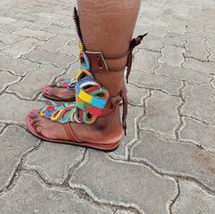 This a pair of brown leather gladiator sandals, they are beaded using multicolor fine beads. They are great gifts for friends and family, they are available in all sizes and are newly made after order in your perfect size. They are great summer shoes and can be worn to the beach and other outdoor activities and functions. They are comfortable and light, they are easy to walk in. The sandals are fully handmade with lots of love . Contact me for any customization and questions. We offer fast dhl s Bohemian Brown Sandals With Ankle Strap, Brown Bohemian Sandals With Ankle Strap, Bohemian Brown Ankle Strap Sandals, Brown Bohemian Flat Heel Sandals, Brown Bohemian Flat Sandals, Handmade Brown Sandals With Ankle Strap, Brown Ankle Strap Barefoot Sandals For Festivals, Bohemian Leather Barefoot Sandals With Ankle Strap, Handmade Brown Sandals With Flat Heel