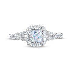 an engagement ring with a princess cut diamond surrounded by round brilliant pave set diamonds