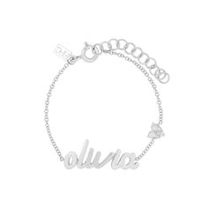 The You Have My Heart Script Name Bracelet was originally created to welcome Emily's beautiful baby girl, Olivia. Featuring your choice of 1-10 gold script letters and our signature heart motif with full-cut diamonds, this custom, one-of-a-kind bracelet comes in two sizes for either baby or mama. Dainty Sterling Silver Custom Name Bracelet, Personalized White Gold Bracelet, Elegant Personalized Charm Bracelet With Nameplate, Dainty Engraved Name Bracelet For Personalized Gift, Elegant Personalized Nameplate Charm Bracelet, Dainty Sterling Silver Name Bracelet For Mother's Day, Engraved Sterling Silver Name Bracelet For Mother's Day, Personalized Dainty White Gold Name Bracelet, Personalized White Gold Name Bracelet As Gift