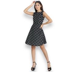 New Timeless Black & White Flared Dress Medium Step Out In Timeless Style With This Charming Sleeveless Dress, Perfect For Any Wardrobe. The Classic Black Fabric Is Adorned With Crisp White Polka Dots, Creating A Look That’s Both Playful And Elegant. This Dress Features A Flattering Silhouette With A Cinched Waistline And A Gently Flared Skirt, Offering A Shape That’s Both Comfortable And Stylish. The Cap Sleeves Add A Touch Of Sophistication, Making It Suitable For A Variety Of Occasions, From Black Knee-length Sundress Mini Dress, Black Sleeveless Fit And Flare Mini Dress, Black Fit And Flare Sleeveless Mini Dress, Black Mini Length Sleeveless Dress, Sleeveless Black Sundress For Party, Fitted Knee-length Sleeveless Sundress, Black Fitted Knee-length Sundress, Black Sleeveless Fit And Flare Midi Dress, Chic Black Sleeveless Sundress