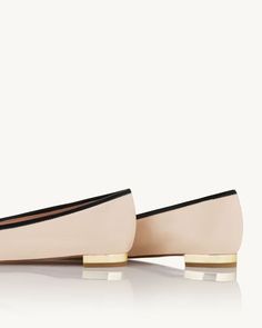 An ode to inimitable French elegance, the Parisina Ballet pumps will never go out of style. Versatile and comfortable, they're crafted from supple, 'Light Nude' nappa leather with a unique high-shine finish that creates a chic contrast with black grosgrain toe caps. Topped with dainty bows, they're the ones you'll come back to time and again. Slip on Metallic flat heel Special gloss finish Padded leather insole Signature logo detailing Material: NAPPA LEATHER Heel Height: 10 mm Made in: Italy Elegant Flats With Sculpted Heel Medium Width, Elegant Medium Width Slip-on Ballet Flats, Luxury Spring Ballet Flats For Galas, Chic Slip-on Ballet Flats In Calf Leather, Chic Evening Ballet Flats With Leather Sole, Elegant Ballet Flats With Pointed Toe And Medium Width, Chic Calf Leather Slip-on Ballet Flats, Luxury Spring Gala Ballet Flats, Elegant Leather Shoes With Contrasting Heel