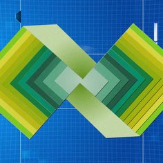 a blue background with green and yellow squares in the shape of rectangles on top of each other