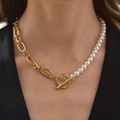 This luxurious Pearl Toggle Necklace combines the sophistication of pearls with the modern design of a chunky chain, making it a stylish and versatile accessory. Available with 24k gold plating or 925 sterling silver plating, this Half Pearl Half Chain Necklace is perfect for women who enjoy blending classic and trendy elements. The bold chain adds a sense of modernity, while the pearls emphasize tenderness and elegance. This necklace would make a great gift for mom, sister, girlfriend, or partn Elegant Metal Toggle Necklace, Gift Pearl Chain Toggle Necklace, Pearl Jewelry With Chunky Chain For Gift, Pearl Necklace With Chunky Chain For Gift, Chunky Chain Pearl Necklace For Gift, Multi-strand Pearl Chain Necklace As Gift, White Pearl Necklace With Chunky Chain For Gift, Elegant Pearl Necklace With Chunky Chain, Half Pearl Half Chain Necklace