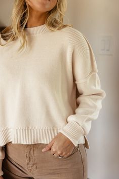 Featuring a drop-shoulder, ribbed material, and a high-low silhouette, the Leda Slouchy Pullover comes in two natural colors that are perfect for Fall. Pair easily with anything in your closet and be extra comfy in this slouchy pullover! high-low side slits black // paired with the sabine high rise wide leg jeans ivory // paired with the stellan wide leg pants Athleisure Mom, Invert Colors, Mom Accessories, High Rise Wide Leg Jeans, Capri Blue, Love Is Free, Swim Dress, Natural Colors, Mommy And Me