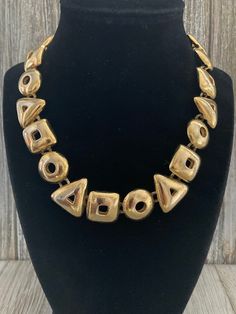 "Fabulous Vintage ANNE KLEIN Signed Gold Modern Runway Collar Necklace Circa 1990's Excellent condition...front is perfect....back has minor wear Signed Anne Klein Very high quality Textured gold finish Modern design Couture look Adjustable toggle closue 17\" overall length, 1\" wide" Retro Adjustable Gold Necklace, Adjustable Retro Gold Necklace, Retro Gold Metal Necklace, Retro Gold-tone Metal Necklace, Gold Runway, Gaudy Jewelry, Single Necklace, Couture Looks, Bib Necklaces