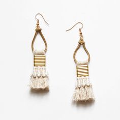 These light weight statement earrings are composed of handmade beige fringe tassels with vintage hand dyed lace and pure brass metal components. A boho tassel earring that is authentically unique. The lace trimming comes in black, white, terracotta (rusty brick), mustard (ochre yellow), beige (sand), Desert rose (dusty pink), magenta (beetroot pink), burgundy (red wine), navy (dark blue), teal (dark turquoise), evergreen (dark emerald) or Dark moss (army green). --------------------------------- Summer Dangle Jewelry With Latkans, Elegant Summer Chandelier Earrings With Tassels, Elegant Summer Tassel Chandelier Earrings, White Bohemian Fringe Earrings, Bohemian Adjustable Macrame Tassel Earrings, Adjustable Gold Bohemian Tassel Earrings, Bohemian Beaded Tassel Earrings For Beach, Bohemian Summer Dangle Tassel Earrings, Summer Bohemian Dangle Tassel Earrings