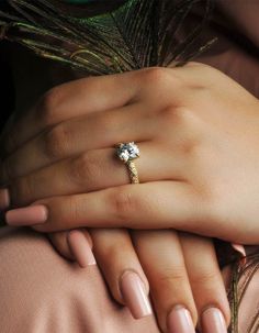 a woman's hand with a ring on her finger