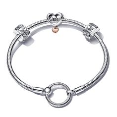 Give your dear sister a heartfelt symbol of sisterhood and family love. On a sterling silver Pandora Moments O Closure Snake Chain Bracelet you'll find an Infinite Hearts Sparkling Clip Charm featuring two rows of alternating raised sterling silver hearts and round stones. Plus, a Love You Sister Heart Charm two-toned in sterling silver and 14k rose gold-plating with "Sister" on both sides in openwork script and a smaller heart dangling from the bottom with the engraving "Love You." Bracelet mea Silver Heart Bracelet For Promise On Mother's Day, Silver Heart Bracelet For Mother's Day Promise, Silver Heart Bead Bracelet For Friendship, Silver Heart Beads Bracelet For Friendship, Elegant Sterling Silver Bracelet For Friendship, Silver Heart Charm Bracelet For Promise, Sterling Silver Heart Beads Bracelet For Anniversary, Anniversary Sterling Silver Bracelets With Heart Beads, Elegant Sterling Silver Charm Bracelet For Friendship