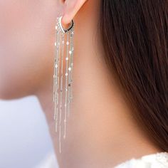 Sparkling tassel chain hoop earrings – The Silver Luna Metal Dangle Threader Earrings For Party, Trendy Silver Fringe Jewelry, Silver Metal Chandelier Earrings With Tassels, Trendy Fringe Metal Jewelry, Dangle Threader Earrings With Adjustable Chain For Party, Elegant Tassel Hoop Earrings, Trendy Threader Earrings For Party, Party Tassel Dangle Earrings With Dangling Charms, Trendy Metal Tassel Earrings For Party