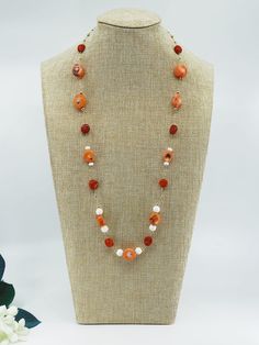 This set is a design sample from The Nine collection which features salmon coral beads in its one-of-a-kind design. ❀ Natural Salmon Coral (10-12mm), Red Coral Coin (10mm), and Seashell Beads (8mm)❀ 14K Gold Filled Clasps and Chain❀ Length: 28 in. Orange Red Coral Beads For Jewelry Making, Orange Red Coral Gemstone Beaded Necklaces, Orange Red Coral Gemstone Beaded Necklace, Orange Red Coral Necklace With Round Beads, Coral Jewelry With Natural Round Beads, Orange Single Strand Red Coral Jewelry, Elegant Red Coral Beaded Necklace With Faceted Beads, Elegant Coral Round Bead Necklaces, Elegant Coral Gemstone Beaded Necklaces