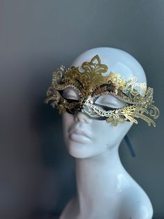 The set includes a striking gold and black mask for him and a captivating gold and black mask for her. The women's mask features a dramatic black feather, adding a touch of allure and mystique to her look. Whether you're attending a grand masquerade ball or a themed gala, this mask set ensures you'll be the center of attention.


Age Group/Gender - Adult/Unisex

Size/Type - One size fits all adults

Mask Color - Gold/Black

Mask Material - Polyresin

Special Features - Black feathers on the wome Mardi Gras Costume Accessories In Gold, Gold Mardi Gras Costume Accessories, Gold Venetian Mask For Halloween, Black Full Face Masquerade Accessories, Black Full Face Masquerade Costume Accessories, Adjustable Gold Costume Accessories, Adjustable Full Face Mask For Masquerade, Gold Costume Masks For Halloween, Gold Mardi Gras Mask Costume Accessories