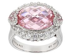 Indulge in the enchanting allure of romance with this exquisite Judith Ripka Pink & White Cubic Zirconia Rhodium Over Sterling Silver Romance Ring. The delicate fusion of white and pink cubic zirconias, totaling an impressive 13.75 carats combined, creates a mesmerizing symphony of elegance on your finger. Crafted by renowned designer Judith Ripka, this stunning ring is a true masterpiece that exudes sophistication and charm effortlessly.  The sterling silver band showcases intricate details tha Elegant Pink Sterling Silver Diamond Ring, Elegant Pink Diamond Ring In Platinum, Glamorous Jewelry For Valentine's Day Formal, Glamorous Valentine's Day Jewelry For Formal Occasions, Glamorous Valentine's Day Formal Jewelry, Elegant Pink Diamond Ring With Gemstone, Elegant Pink Sterling Silver Rings, Elegant Diamond Cut Ring For Valentine's Day, Luxury Oval Ring For Valentine's Day