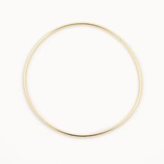 14k gold plated Sterling Silver 63cm inner diameter  1.8mm width  Our gold bangles are a classic and dainty piece of jewellery that is a staple to everyone's jewellery collection. Whether you wear it as a stand alone statement piece or later it with 2 or 3 bangles and even add some bracelets. These bangles make the perfect gift for yourself or someone special and comes packaged in a beautiful box. 14k Gold Filled Bangle In Gold Color, 14k Yellow Gold Bracelet With Simple Design, Simple 14k Yellow Gold Bracelet, Yellow Gold 14k Bracelet, Gold Hoop Bangle In Minimalist Style, Minimalist Gold Hoop Bangle, Minimalist Gold Hoop Bracelet, Simple Bangle Jewelry For Everyday Use, Minimalist Brass Gold Bracelet Tarnish Resistant