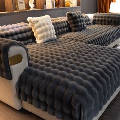 a large couch with pillows on top of it