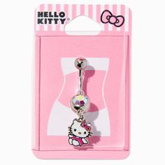 a hello kitty belly ring with a pink bow on it