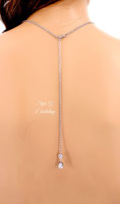 Finish: Silver Platinum or Rose gold plated Material: Top quality rhinestones,AAA Zirconia, lobster clasp, Platinum plated Rhinestone Bail. (Pic.10) Color of Teardrop: Navy Blue ,Peach Morganite ,Green Apple ,Aqua Blue or Clear Zirconia. Size of Teardrop: 19mm ~Necklace Length of Necklace: 17.5 inches We provided two backdrops for you to choose: 1) Style.A :with 7 inches teardrop AAA zirconia pendant backdrop 2) Style.B :with 6 inches teardrop AAA zirconia pendant backdrop 3) Style.G With 8 inch Silver Body Jewelry With Adjustable Chain For Wedding, Silver Adjustable Chain Body Jewelry For Wedding, Silver Adjustable Body Jewelry For Weddings, Delicate Chain Cubic Zirconia Backdrop Necklace As A Gift, Silver Delicate Chain Body Jewelry As Gift, Adjustable Silver Body Jewelry With Delicate Chain, Silver Dainty Body Jewelry With Delicate Chain, Delicate Chain Body Jewelry For Wedding, Delicate Adjustable Silver Body Jewelry