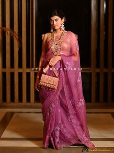 "Purple Chikankari Saree in Organza Fabric for Women Hand Embroidered Lucknowi Chikan Sari for Wedding Bollywood Wear Sari Blouse for Her > Saree Fabric: Organza > Saree Length: 5.9 Mtrs. > Blouse Fabric: Organza > Blouse Length: 0.80 Mtrs. > Occasions: Party Wear, Wedding Wear, Festive Wear > Price Includes: Saree with an Un-stitched Blouse Thechikanlabel designer studio presents \"Purple Chikankari Saree in Organza Fabric for Women\" Floral motifs with 'intricate embroidery' are delicately placed on this handmade Chikankari Saree, this perky hand embroidered Lucknowi Chikan Sari is a reminiscent of blooming springs and the serenity that surrounds it. Your skin will surely fall in love with soft fabric that will keep you comfortable all day long and make yourself happier this season by ch Unstitched Purple Traditional Wear For Wedding, Wedding Chanderi Traditional Wear For Navratri, Embroidered Tissue Silk Traditional Wear For Wedding, Designer Traditional Organza Wear With Chikankari Embroidery, Chikankari Embroidered Organza Choli With Traditional Drape, Purple Blouse Piece With Chikankari Embroidery For Saree, Purple Chanderi Saree For Reception, Purple Blouse Piece With Chikankari Embroidery, Embroidered Organza Saree For Wedding