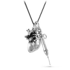 I made this Anatomical Heart and Syringe necklace and my world immediately went black and white. Buxom, corsetted wenches started sliding out of the shadows holding wooden bowls of musty apples and the slick cobbled streets echoed the shrieks of the crows in the darkness above. Heavy velvet, the color of blood, flashed in front of my eyes before running down the midnight alley, leaving a memory of cold steel and anguish in my nostrils. Gas lamps flicker and die. The night gets thicker, weightier Gothic Noir, Bridal Veils And Headpieces, Witch Necklace, Carved Heart, Horn Jewelry, Anatomical Heart, Necklace Antique, Skull Necklace, Halloween Jewelry