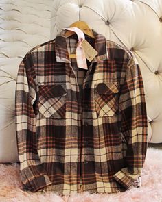 The softest sweet flannel for the season. Rich brown & rust tones pair with a button up front & cute pockets. Easy fit & perfect as is or layered. Color: Brown, cream & rust Soft poly & cotton blend Hand wash cold Small Medium Large Bust 42 44 46 Waist 42 44 46 Hips 43 45 47 Length 28 28 28 Bust, waist, and hip measurements are a total circumference. Length is measured from the top of the shirt to the hem. Measurements are an estimate. Cheap Vintage Winter Flannel Shirt, Cheap Vintage Flannel Shirt With Buttons, Classic Brown Long Sleeve Flannel Shirt, Classic Brown Shirt For Winter, Brown Everyday Collared Shirt, Brown Cotton Shirt For Winter, Classic Brown Button-up Flannel Shirt, Brown Button-up Cotton Flannel Shirt, Brown Button-up Flannel Shirt For Fall