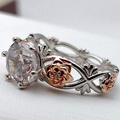 Celebrate life with this intricate rose-themed floral crystal ring that's perfect for the season of love! Made with beautiful zircon in a prong setting in a zinc alloy base, that's carved meticulously to suit your taste, this ring is every woman's envy! Specifications: Long-lasting and durable material Available in different sizes Can be used as a wedding band for everyday use Perfect valentine's day present for your loved one! Material: AAA CZ Crystal Rose Design Flower Promise Ring, Rose Gold Metal Rings For Wedding, Rose Gold Flower-shaped Cubic Zirconia Rings, Rose Gold Flower-shaped Rings With Cubic Zirconia, Elegant Alloy Rings For Gift, Elegant Rose Design Promise Ring, Silver Alloy Wedding Rings, Rose Gold Cubic Zirconia Flower Promise Ring, Silver Metal Flower Ring For Wedding