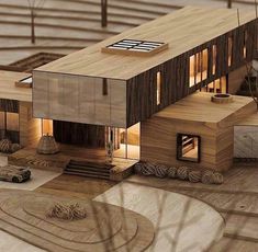 an architectural model of a house in the middle of a room with wood flooring