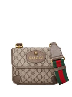 First used in the 1970s, the GG logo was an evolution of the original Gucci rhombi design from the 1930s, and from then it's been an established symbol of Gucci's heritage. This small messenger bag combines the signature motif with the Web stripe—a timeless pairing that pays homage to Gucci's roots. Beige/ebony GG Supreme canvas, a material with low environmental impact, with brown leather trim. Brass hardware. Oval Gucci leather tag with metal feline head. Green and red Web strap. Flap pocket o Vintage Gucci Messenger Bag, Gucci Messenger Bags, Vintage Messenger Bag, Brass Accessories, Quilted Wallet, Small Messenger Bag, Canvas Messenger Bag, Quality Handbags, Gucci Leather