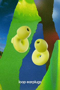 two yellow buttons are attached to a green and blue background with the words loop earplugs