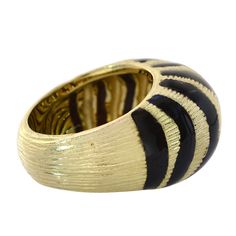 Designed to enhance the lifestyle of the modern woman, this stunning ring reflects the latest European fashion trends. Made in Italy this fashion ring plays with both the geometric and color trends, creating something that inspires imagination. Designed with enamel stripes and crafted in 18k yellow gold the rings weight is 18.5 grams size is 7. She'll love this gorgeous ring! For re-sizing information, please contact us Avital & Co Jewelry at (212) 764-6851. Payment: Payment must be received Modern Enamel Rings For Formal Occasions, Modern Enamel Open Ring With Polished Finish, Modern Polished Enamel Open Ring, Modern Polished Finish Open Enamel Ring, Modern Polished Enamel Ring, Modern Black Enamel Open Ring, Modern Yellow Gold Enamel Ring, Italy Fashion, Black Enamel