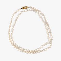 This is a truly exceptional piece - an genuine vintage MIKIMOTO Japanese Akoya pearl necklace with an 18K yellow gold pearl clasp, adorned with the renowned Mikimoto trademark. The necklace is a classic, timeless design that is sure to be treasured for generations to come. Measuring 32" (81cm) in length and weighing 47.8 g, the necklace is made up of high-quality cultured Akoya pearls farmed in Japan. The pearls are 7.0 to 7.5 mm in size and exhibit a stunning white color with pink and green overtones. The luster is exceptional, reflecting the unparalleled quality of Mikimoto pearls. The pearls are round in shape and have a surface that is very clean with only a few natural inclusions - a testament to their genuineness and quality. As an added bonus, the necklace comes with a vintage Mikim Classic Pearl Chain Jewelry, Classic Gold Pearl Necklace, Classic Gold Single Strand Pearl Necklace, Classic Single Strand Pearl Necklace With Round Beads, Classic Formal Pearl Necklace With Pearl Charm, Classic Akoya Pearl Necklace, Classic Single Strand Round Pearl Necklace, Classic Single Strand Pearl Necklace, Classic Single Strand Pearl Necklace Gift