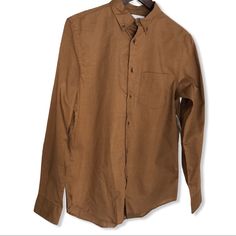 Old Navy Slim Fit Button Down. Chest:20” New With Tag. Brown Long Sleeve Shirt With Buttons, Brown Collared Shirt With Buttoned Pockets, Khaki Button-up Shirt With Button Closure, Brown Button-up Shirt With Buttoned Pockets, Everyday Khaki Shirt With Buttons, Everyday Khaki Shirt, Brown Relaxed Fit Button-up Top, Brown Cotton Shirt For Work, Classic Beige Tops With Buttoned Pockets