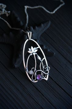 The size H 4 cm x W 3 cm (1 3/4 x 1 inch). Weight - 6g. You can buy it with the chain or without. The most delicate flower of the lotus can make someone very happy. I made this botanical jewelry of sterling silver, amethyst, and peach moonstone. This is a true work of art. It will emphasize your exquisite taste and status, and will also bring a lot of compliments. Lotus flower earrings https://www.etsy.com/listing/676137548/lotus-flower-earrings-sterling-silver?ref=shop_home_active_2&frs=1 O Elegant Wire Wrapped Jewelry For Meditation, Amethyst Amulet Jewelry For Gifts, Amethyst Amulet Jewelry As Gift, Hand Forged Flower Pendant Necklace As Gift, Wire Wrapped Flower Pendant Jewelry Gift, Handmade Spiritual Jewelry With Flower Pendant, Artistic Silver Wire Wrapped Necklaces, Artistic Silver Wire Wrapped Necklace, Handmade Teardrop Pendant Jewelry For Wedding