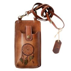 A modern style on traditional leather bag, our Phone Bag holds everyday essentials - phone, cards, and cash. Wear it as a crossbody bag or shoulder sling bag by adjusting the strap. Thema of "Dream Catcher" is carved on front side. Dimensions: Height  :  20 cm / 7,9 ″  Width   :   11 cm / 4,3 ″ Strap :      112 cm / 44,1 ″  (max. size. / shortable) Phone pocket is large enough and for all mobile phones. (iphone 7 plus used in photos) Rectangular Leather Phone Bag With Card Slots, Rectangular Leather Phone Bag With Interior Card Slots, Leather Phone Bag With Card Slots For Travel, Leather Phone Bag With Interior Card Slots For Travel, Leather Crossbody Phone Bag With Interior Card Slots, Leather Crossbody Phone Bag With Hidden Sleeve, Leather Shoulder Bag With Card Slots For Daily Use, Leather Rectangular Shoulder Bag With Hidden Phone Sleeve, Leather Phone Bag With Card Slots For Everyday