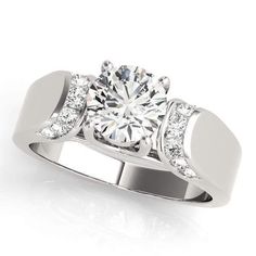 a white gold engagement ring with diamonds on the sides and a center stone in the middle