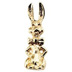 10 Karat Yellow Gold Rabbit Charm- Here comes Peter Cottontail! This adorable 3D charm features a smiling bunny happily wearing his bowtie! Beautifully detailed in 10K yellow gold. *Chain not included Size: 22 mm x 7 mm Weight: 1.8 dwt. / 2.9 gr. Stamped: 10K Very good condition, professionally polished. Will come packaged in a gift box or pouch (when possible). Gold Rabbit, Here Comes Peter Cottontail, Rabbit Charm, Peter Cottontail, Yellow Gold Chain, Here Comes, Vintage Charms, Gold Chain, Jewelry Necklace Pendant