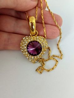 "Gorgeous piece of jewelry. NAPIER stamped unique chain. Gold-tone heart pendant stamped 290. Big diamond cut amethyst glass in the center with white crystals. Length; 16\" Ppendant:1.1/4\" x 1\" Perfect condition. Lovely gift. Thank you for visiting my store. You can also visit my MargaretJewelryShop or http://jewelryandclothing.net/" Gold Heart-shaped Jeweled Jewelry, Gold Jeweled Heart Jewelry, Heart-shaped Jeweled Jewelry Gift, Heart-shaped Jeweled Jewelry For Gift, Heart Shaped Jeweled Jewelry For Gift, Vintage Purple Heart-shaped Jewelry, Heart Pendant Necklace Gold, Blue Topaz Pendant Necklace, Big Light