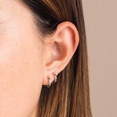 These 10mm silver huggies are simple and easy to wear everyday and can be dressed up or down. Get multiple for a super coherent look, or pair with any other statement pieces to support them perfectly. Made in Italy, you'll never have to worry about taking them off! Earring Stack, Early Black Friday, Dainty Studs, Everyday Earrings, Staple Pieces, Solid Yellow, Ring Bracelet, Rhodium Plated, Ring Earrings