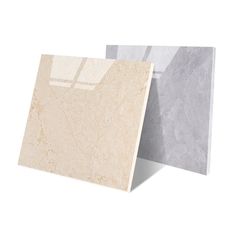 two different colors of marble tiles on white and grey walls, one is light beige