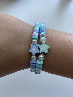 This bracelet is a cute summer friendship bracelet with blue and turquoise stars Cute Blue Beaded Friendship Bracelets, Cute Adjustable Turquoise Beaded Bracelets, Cute Blue Friendship Bracelets Gift, Cute Adjustable Star-shaped Bracelets, Cute Adjustable Star Bracelets, Blue Handmade Star-shaped Beaded Bracelets, Trendy Handmade Turquoise Friendship Bracelets, Trendy Blue Bracelets For Summer, Handmade Star-shaped Friendship Bracelets