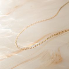 Our Dainty Mariner Chain Necklace is an absolute necessity for your jewelry collection. Its texture and shine add the perfect touch for every occasion. If you’re looking for a necklace to wear every day - this is it! It looks amazing on its own and even better paired with other layering necklaces. Made of 14k solid gold, this necklace is sure to keep its shine and never trouble you with tarnishing or irritation. Get ready for compliments - you're going to love how you look & feel in your Dainty Everyday Luxury 14k Gold Oval Link Necklace, Minimalist 14k Gold Oval Link Necklaces, Delicate 14k Gold Necklace With Figaro Chain, Minimalist 14k Gold Necklace For Everyday Luxury, Delicate 14k White Gold Chain Necklace, Everyday Durable White Gold Necklace, Everyday Tarnish Resistant White Gold Necklace, Elegant Everyday Necklaces With Rolo Chain, Delicate Chain 14k White Gold Necklace