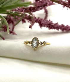 This beautiful and elegant gold plated ring has a mix of topaz and white cubic zirconia stones in 4 different sizes. The perfect gift for you or a loved one. Details ✔ 925 sterling silver with Gold Plated ✔ Stone: Topaz + white cz ✔ High Quality ✔ Non Tarnish ✔ Free polishing cloth for jewelry Jewelry Care ✔ Please be cautious with your jewelry. Some pieces are very dainty. It's possible to scratch/chip if you're not careful. ✔ Preserve your jewelry's shine by avoiding harsh chemicals such as be Stackable Cubic Zirconia Promise Rings With Center Stone, Dainty White Gold Crystal Ring With Cubic Zirconia, Delicate Cubic Zirconia Diamond Ring With Prong Setting, Delicate Diamond Ring Vs Clarity, Delicate Cubic Zirconia Diamond White Ring, Dainty Diamond White Crystal Ring With Cubic Zirconia, White Cubic Zirconia Dainty Rings, Dainty Cubic Zirconia Birthstone Promise Ring, White Dainty Cubic Zirconia Rings