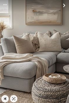 a living room filled with furniture and pillows