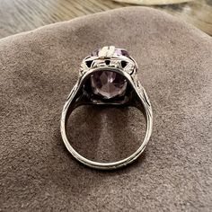 Centering a rectangular faceted amethyst measuring approx. 16.7 x 8.6 mm, fashioned in 18k white gold. Size 5. ______ At Doyle & Doyle, jewelry is as sustainable as it is beautiful. Our vintage and antique jewelry is innately ethical and conflict-free as it does not involve any new mining or negative environmental impact. We are proud that our in-house jewelry line Heirloom by Doyle & Doyle is made exclusively for us by our team of expert jewelers in New York City. These jewels are created in re Elegant Rectangular Amethyst Ring For Formal Occasions, Art Deco Rings With Rectangular Stone For Formal Occasions, Vintage Platinum Ring With Gemstone, Classic Amethyst Ring With Rectangular Stone For Formal Occasions, Elegant Amethyst Ring With Rectangular Stone For Formal Occasion, Elegant Formal Amethyst Ring With Rectangular Stone, Purple Heirloom Ring For Formal Occasions, Elegant 14k White Gold Amethyst Ring With Center Stone, Classic Purple Rings For Formal Occasions