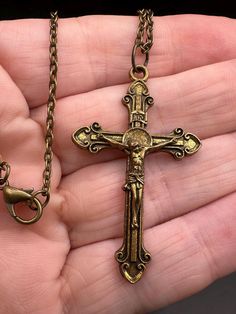 Unique vintage cross.  Great details!  Wear on finish. Vintage Crucifix Cross Necklace Gift, Vintage Crucifix Cross Necklace As Gift, Antique Bronze Cross Necklace, Vintage Metal Cross Necklace, Vintage Brass Cross Pendant Jewelry, Vintage Metal Crucifix Cross Necklace, Vintage Cross Necklace In Metal, Vintage Brass Cross Pendant Necklace, Vintage Cross Shaped Metal Jewelry