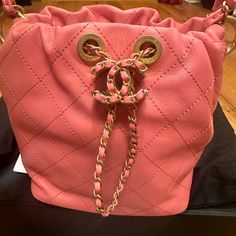 Chanel Pink Quilted Lambskin Drawstring Bucket Bag W/ Gold Hardware. Never Worn. Comes With Box And Receipt. Designer Soft Leather Bucket Bag, Designer Soft Leather Bucket Bag For Evening, Designer Soft Leather Evening Bucket Bag, Designer Pink Bucket Bag For Travel, Luxury Pink Bucket Bag For Travel, Designer Soft Leather Bucket Bag Pouch, Luxury Crossbody Bucket Bag, Designer Soft Leather Pouch Bucket Bag, Luxury Pink Bucket Bag For Shopping