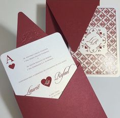 two red and white wedding cards on top of each other, one with an ace playing card