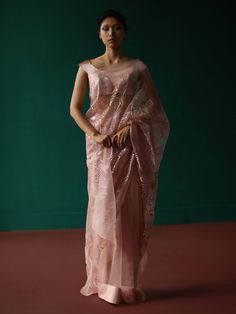 Pre - pleated rosegold organza saree adorned with geometric floral applique'. Set includes pre-pleated saree with petticoat and plain unstitched fabric for blouse. Shell fabric - novel organza base; Appliqué - novel satin Metallic appliqué in our geometric floral pattern. Components - 3 Please note: Stitched blouse is not included. Pleated Saree, Lehenga Blouse, Organza Saree, Saree Online, Floral Applique, Branding Inspiration, Sarees Online, Trouser Pants, Petticoat