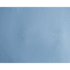 a blue wall with some white paint on it's sides and the bottom half painted in light blue