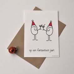 a card with two birds wearing hats and holding champagne glasses on top of each other